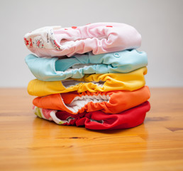 Stack of cloth diapers on a wooden table