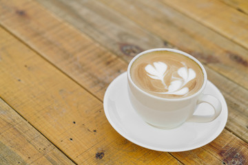 Latte Coffee art on the wooden table