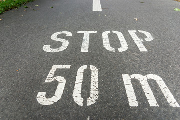Stop 50 meters on city asphalt on floor