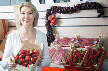 friendly female grocery worker at local market