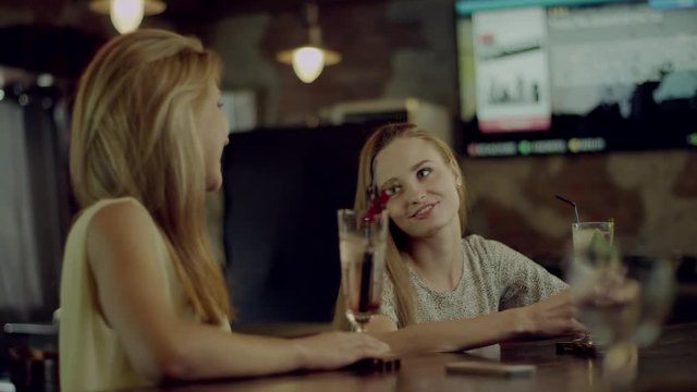 women talking in a bar