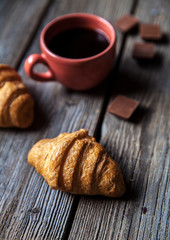 delicious breakfast with a cup of coffee and fruit sandwiches, croissants. Strawberries, food, drink, chocolate.