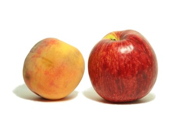 Fototapeta na wymiar Peach and red apple