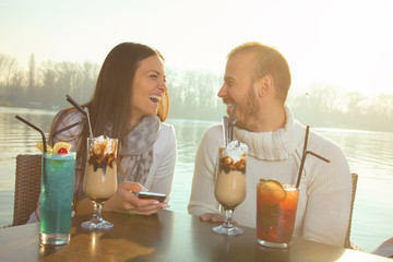 Couple in love using cellphone.

