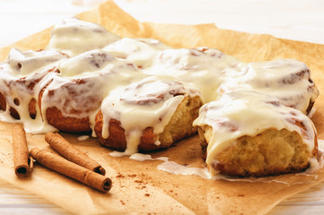 Cinnamon buns glazured with cream cheese  .