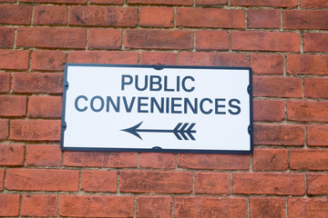 Fototapeta na wymiar Public Conveniences sign on wall