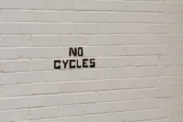Fototapeta na wymiar No Cycles stencil sign on wall