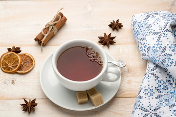 Obraz na płótnie Canvas Teacup of hot tea and napkin