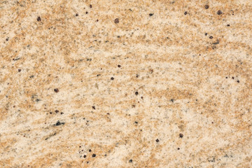 Brown stone with black spots, background, texture