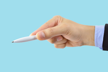  male hand holding a pen blue background