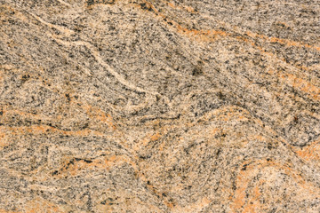 Brown stone with black spots, background, texture