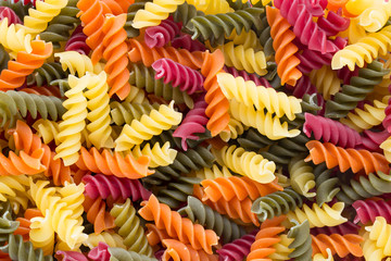 Closeup of raw eco macaroni pasta background.