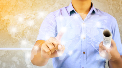 a man with pressing hand using virtual global network on button concept and concrete wall background ,soft light