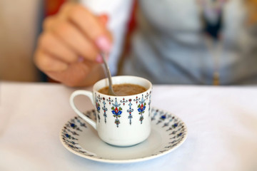 Girl having coffee in cafe