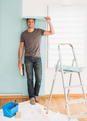 handsome man posing wallpaper on the walls of his apartment