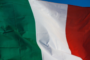 Italian Flag Blowing In The Wind, Waving Flag Of Italy, Europe, Italian Republic, Italy Flag Of Silk On Blue Sky Background, Green, White And Red Are National Colors Of Italy.  National Flag Of Italy