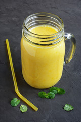 Orange smoothie with mint leaves