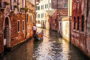 Fototapeten VENICE, ITALY - AUGUST 17, 2016: Traditional gondolas on narrow canal close-up on August 17, 2016 in Venice, Italy. © Unique Vision