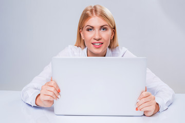 Fototapeta premium Young businesswoman working at laptop computer.
