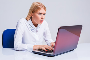 Young businesswoman working at laptop computer.