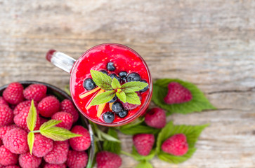 Berry smoothie from raspberry fresh fruits from above