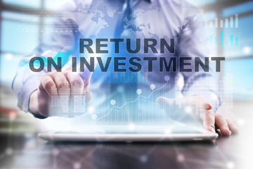 Businessman is using tablet computer, pressing button on touch screen and selecting 