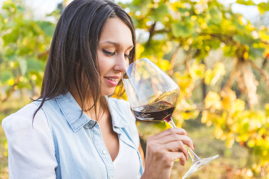 Attractive woman drinking red wine