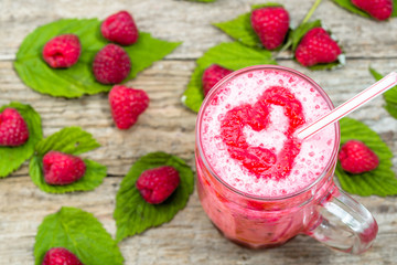 Blended smoothie, raspberry fresh fruits milkshake in a glass jar