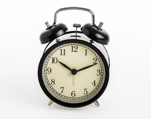 Black alarm clock isolated on white background