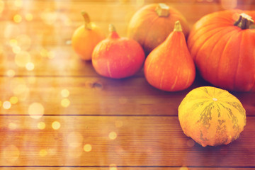 close up of pumpkins on wooden table at home