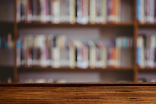 Wooden table with library background