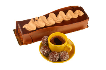 chocolate cake with cup of coffee and chocolate balls, isolated