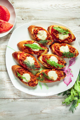 Toast with minced meat, tomato sauce and mozzarella cheese.