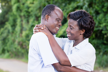 Fototapeta premium happy young couple embracing face to face in campaign