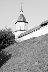Fototapeta na wymiar Tower of an ancient monastery on the hill black and white