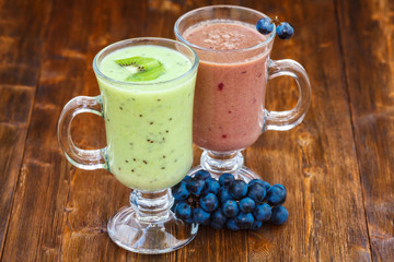Grape and kiwi fruit milk smoothie in a glass