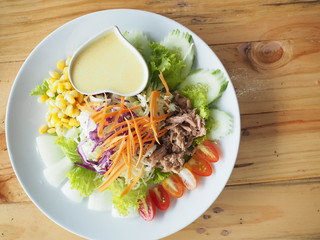 Tasty salad , tuna and vegetables on the plate