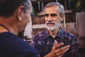 Glass blower interacting with each other