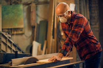 Carpenter at work at his workshop