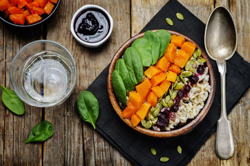 rice bowl with spinach, pumpkin, pumpkin seeds and cranberry sau