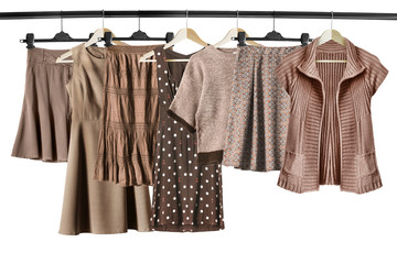 Brown clothes on clothes racks - obrazy, fototapety, plakaty