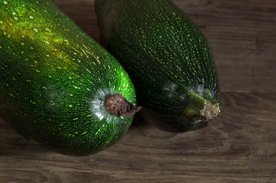 two zucchini on the wooden table