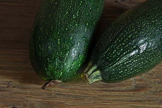 two zucchini on the wooden table