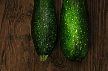 two zucchini on the wooden table