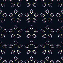 Colored stars on a dark background. Seamless pattern. Vector