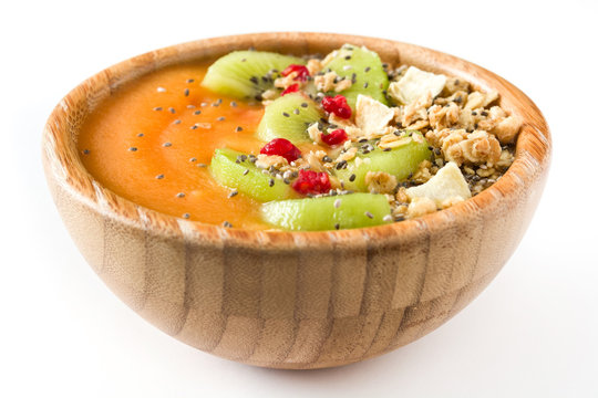 Healthy Smoothie With Fruit, Cereals And Chia Seeds In A Bowl Isolated On White Background

