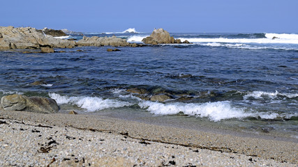 Waves crash ashore Pacific Grove California