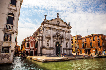 VENICE, ITALY - AUGUST 19, 2016: Famous architectural monuments and colorful facades of old...