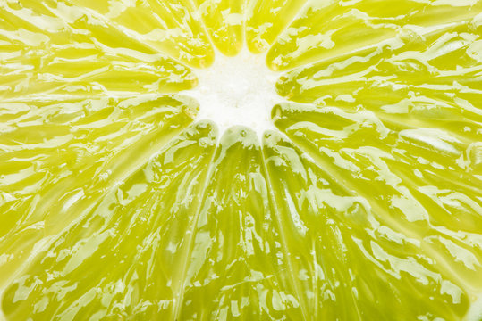 Juicy slice of lime extreme close up filling frame 