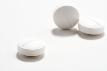White tablet pills medication on white